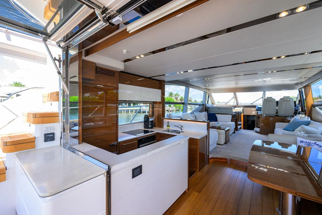 The yacht's salon features a modern, open layout with luxurious seating and ample natural light. aboard MISS AMY Yacht for Sale