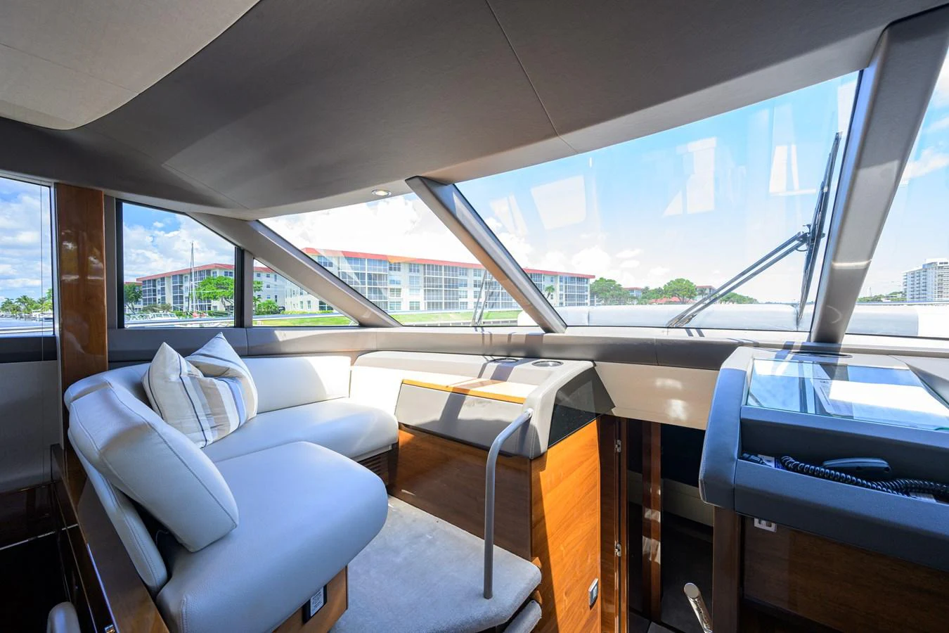 The helm area features comfortable seating and expansive windows for a panoramic view. aboard MISS AMY Yacht for Sale