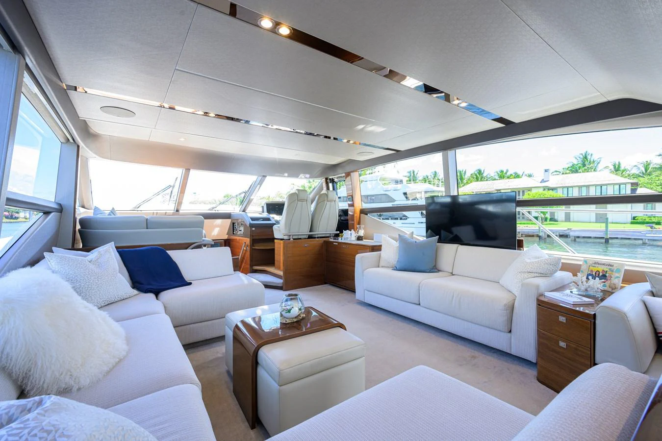 The yacht's salon features plush seating, large windows, and a modern entertainment system, creating a luxurious and inviting atmosphere. aboard MISS AMY Yacht for Sale