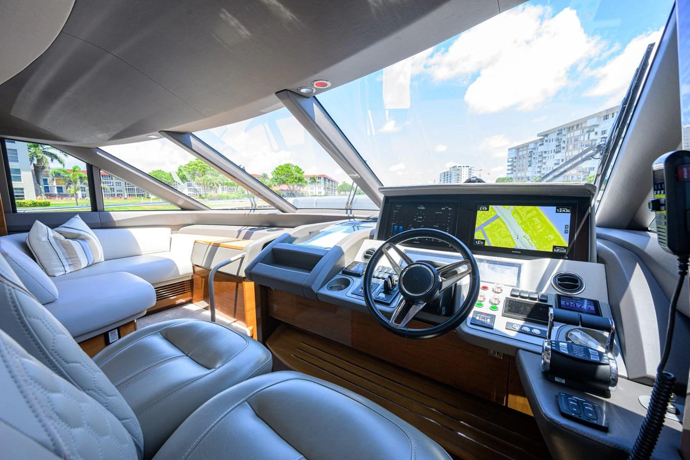 The helm station features modern navigation equipment and luxurious seating with panoramic views. aboard MISS AMY Yacht for Sale