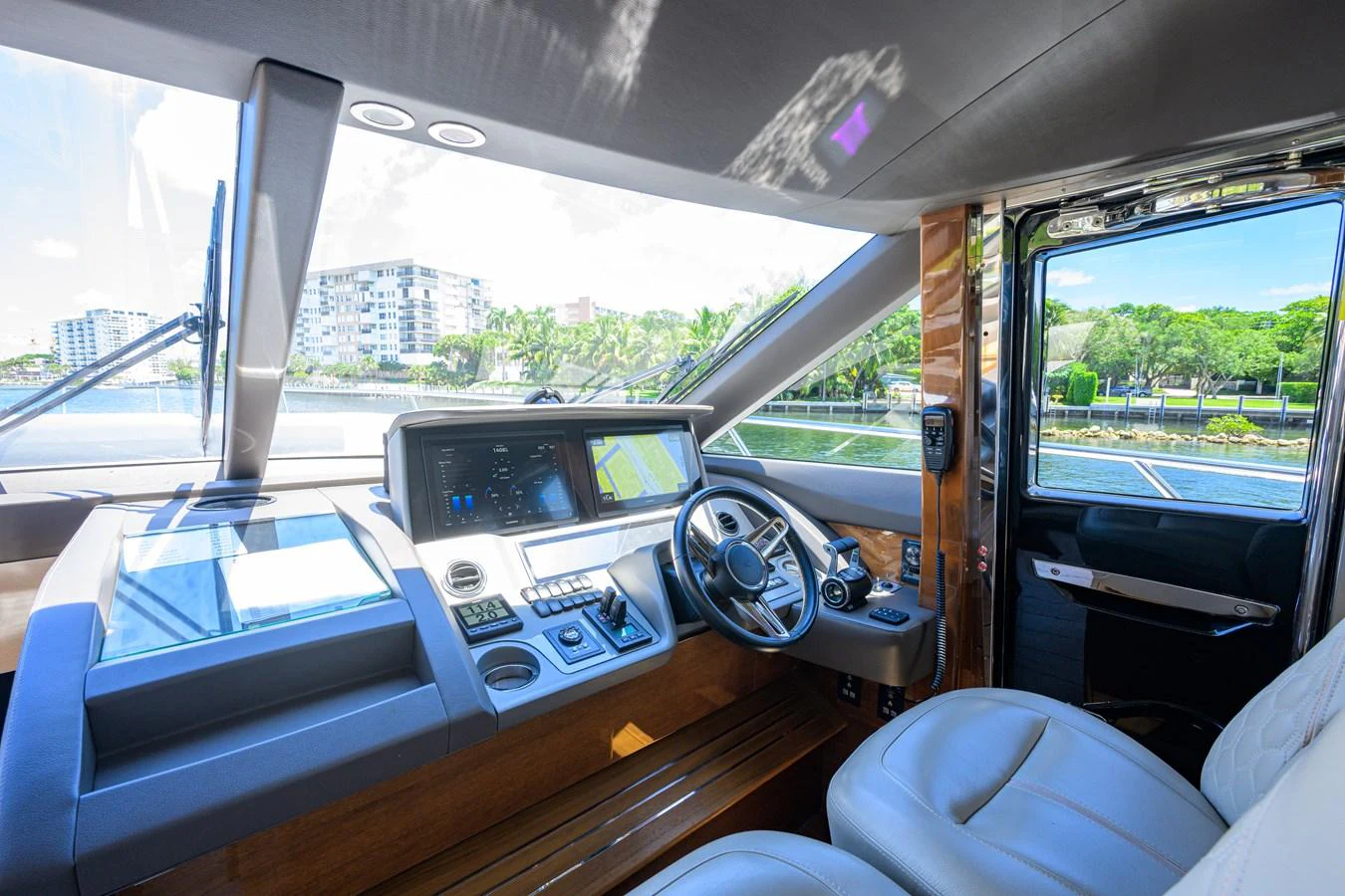The helm station features modern navigation equipment and comfortable seating. aboard MISS AMY Yacht for Sale