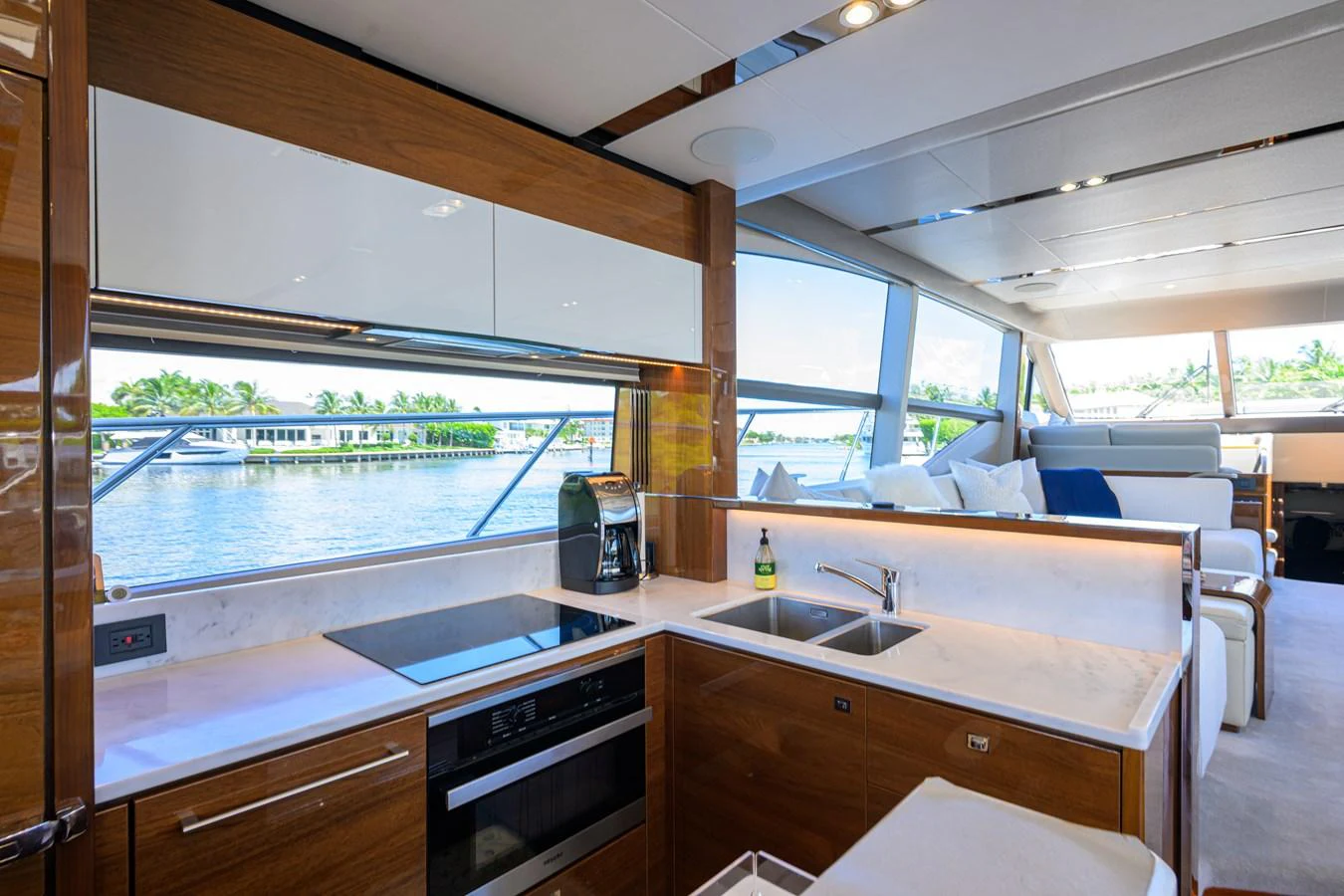 The yacht's galley features modern appliances and a sleek design with a view of the water. aboard MISS AMY Yacht for Sale