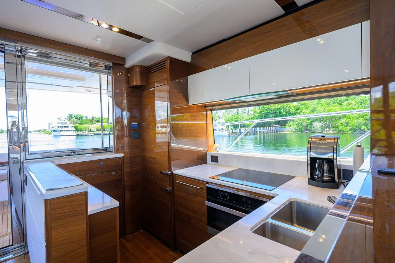 The yacht's galley features modern appliances and a sleek design with ample natural light. aboard MISS AMY Yacht for Sale
