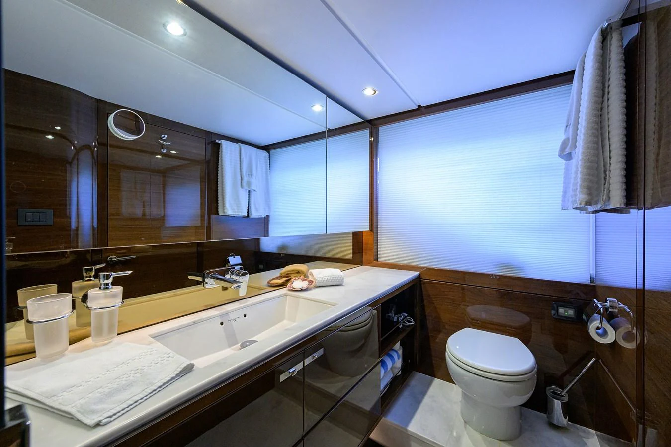 The yacht's bathroom features modern fixtures and a sleek design with ample lighting. aboard MISS AMY Yacht for Sale