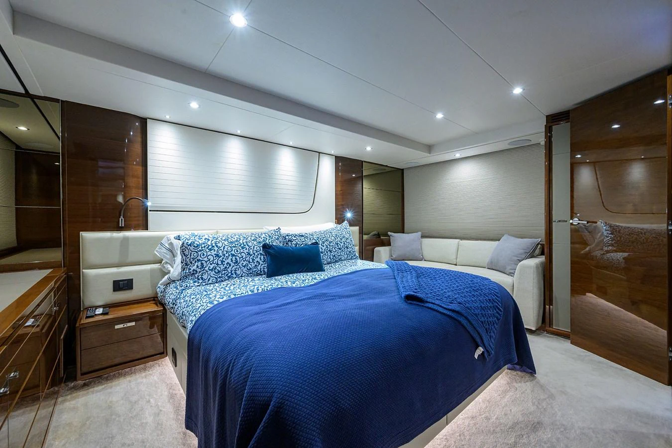 The master stateroom features a luxurious bed with plush bedding and elegant wood finishes. aboard MISS AMY Yacht for Sale