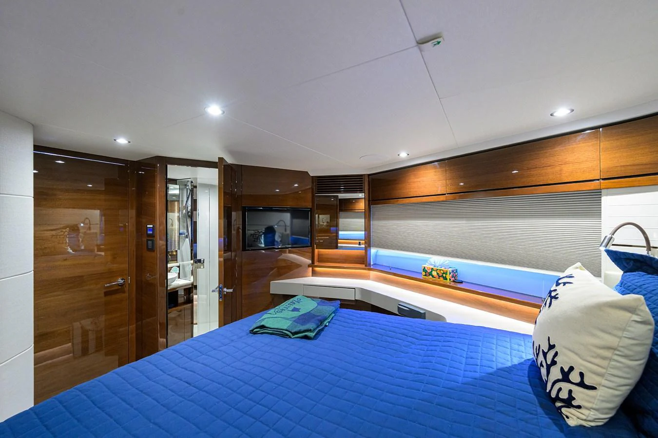 A luxurious stateroom featuring a comfortable bed with elegant decor and modern lighting. aboard MISS AMY Yacht for Sale
