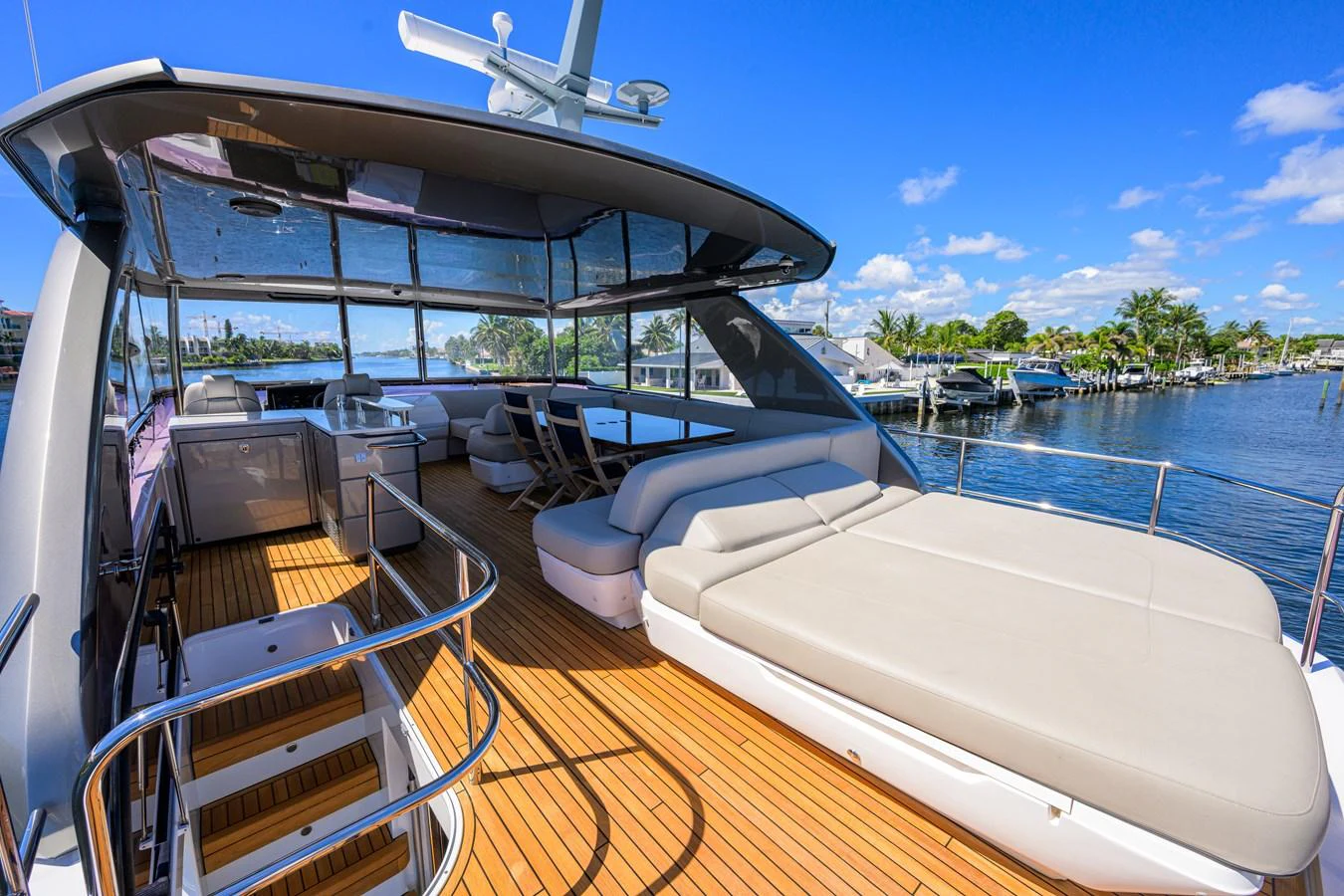 The flybridge offers a spacious lounging area with stunning views of the water and surrounding landscape. aboard MISS AMY Yacht for Sale
