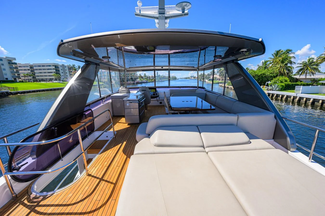 The flybridge offers a spacious and luxurious outdoor living area with ample seating and stunning views. aboard MISS AMY Yacht for Sale