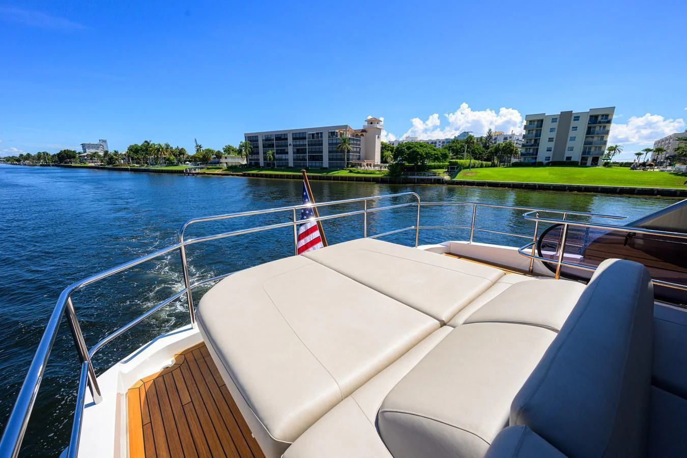 The sundeck offers a luxurious lounging area with a beautiful waterfront view. aboard MISS AMY Yacht for Sale