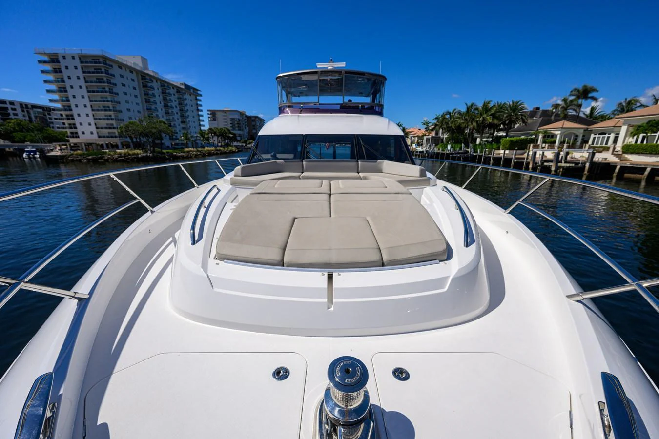 The yacht's foredeck features a spacious sunbathing area with plush cushions, perfect for relaxation. aboard MISS AMY Yacht for Sale