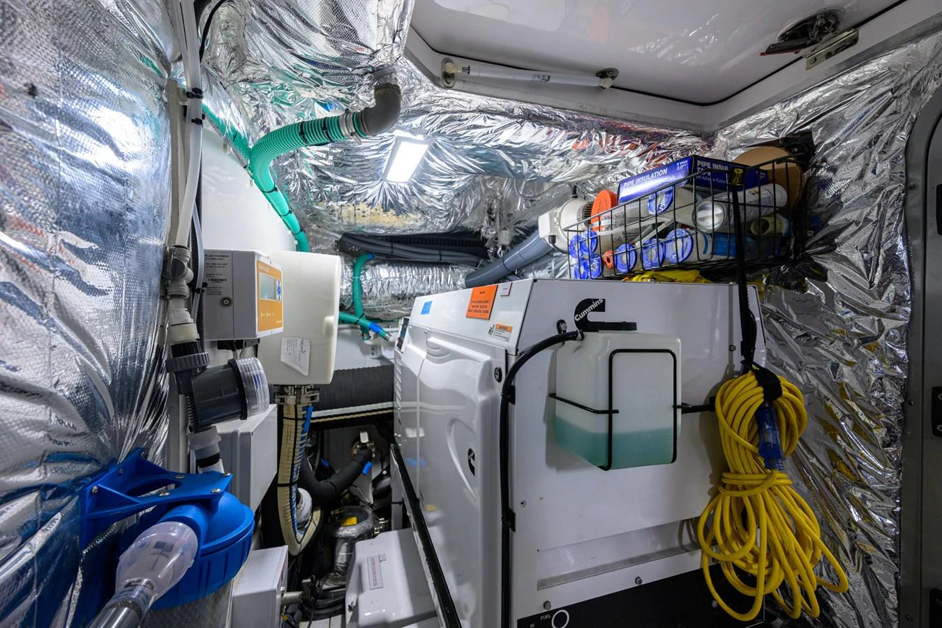 The image showcases the well-organized engine room of the yacht, featuring various technical equipment and storage solutions. aboard MISS AMY Yacht for Sale