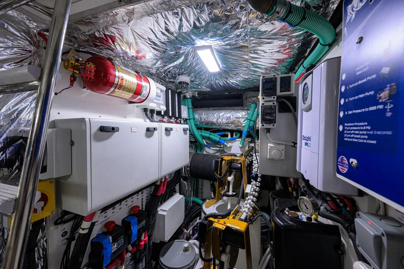 The engine room is equipped with advanced machinery and safety equipment, showcasing a well-organized and functional space. aboard MISS AMY Yacht for Sale