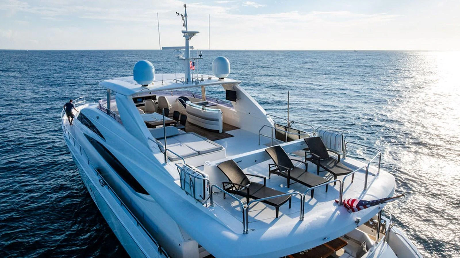The yacht's spacious aft deck offers luxurious lounging areas with stunning ocean views. aboard OASIS Yacht for Sale