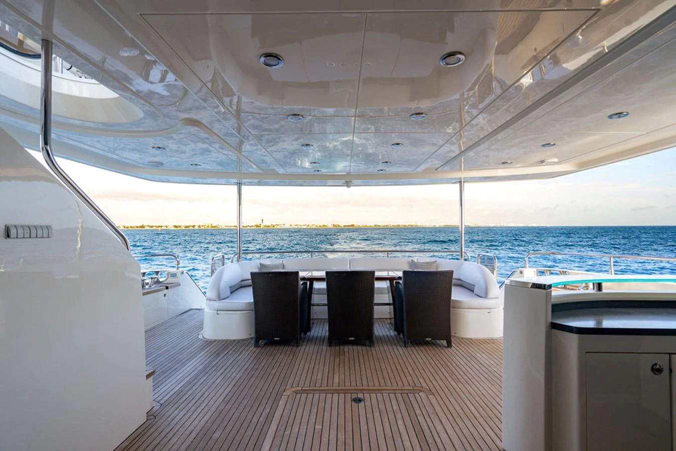 The aft deck offers a spacious and inviting area for alfresco dining with stunning ocean views. aboard OASIS Yacht for Sale