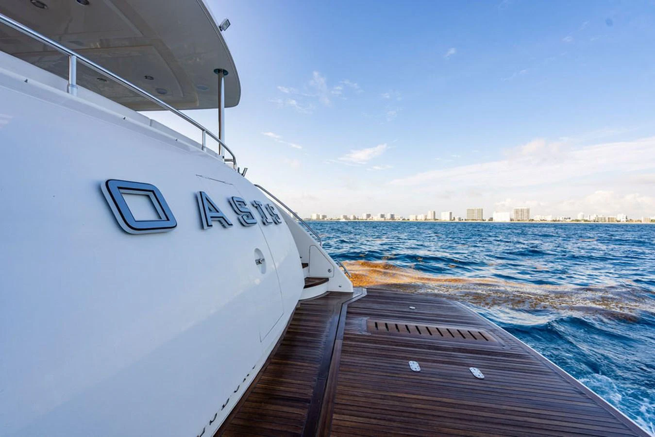 The yacht's sleek exterior is complemented by a spacious aft deck with a stunning view of the open sea. aboard OASIS Yacht for Sale