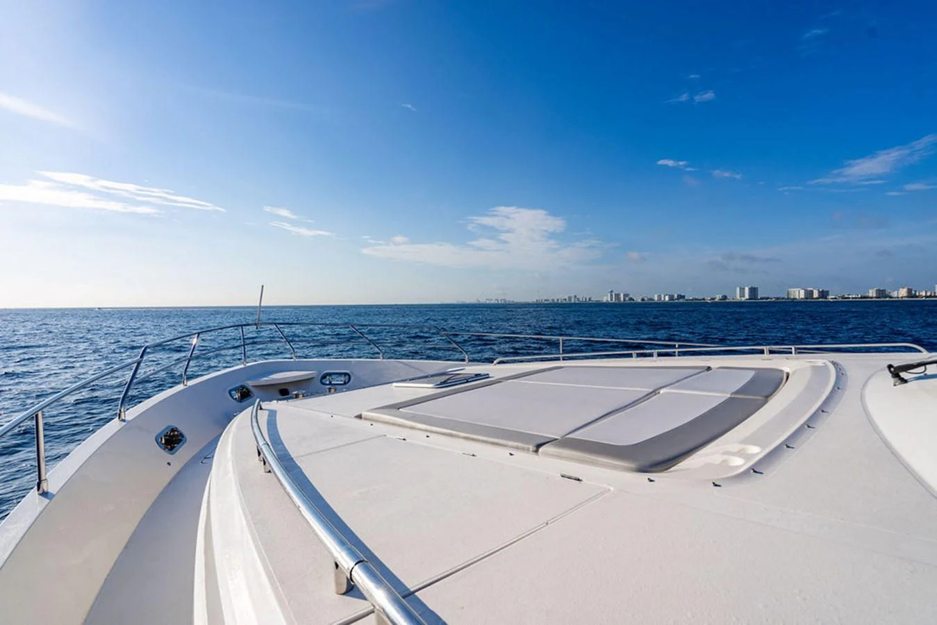 The foredeck of the yacht offers a spacious sunbathing area with stunning ocean views. aboard OASIS Yacht for Sale