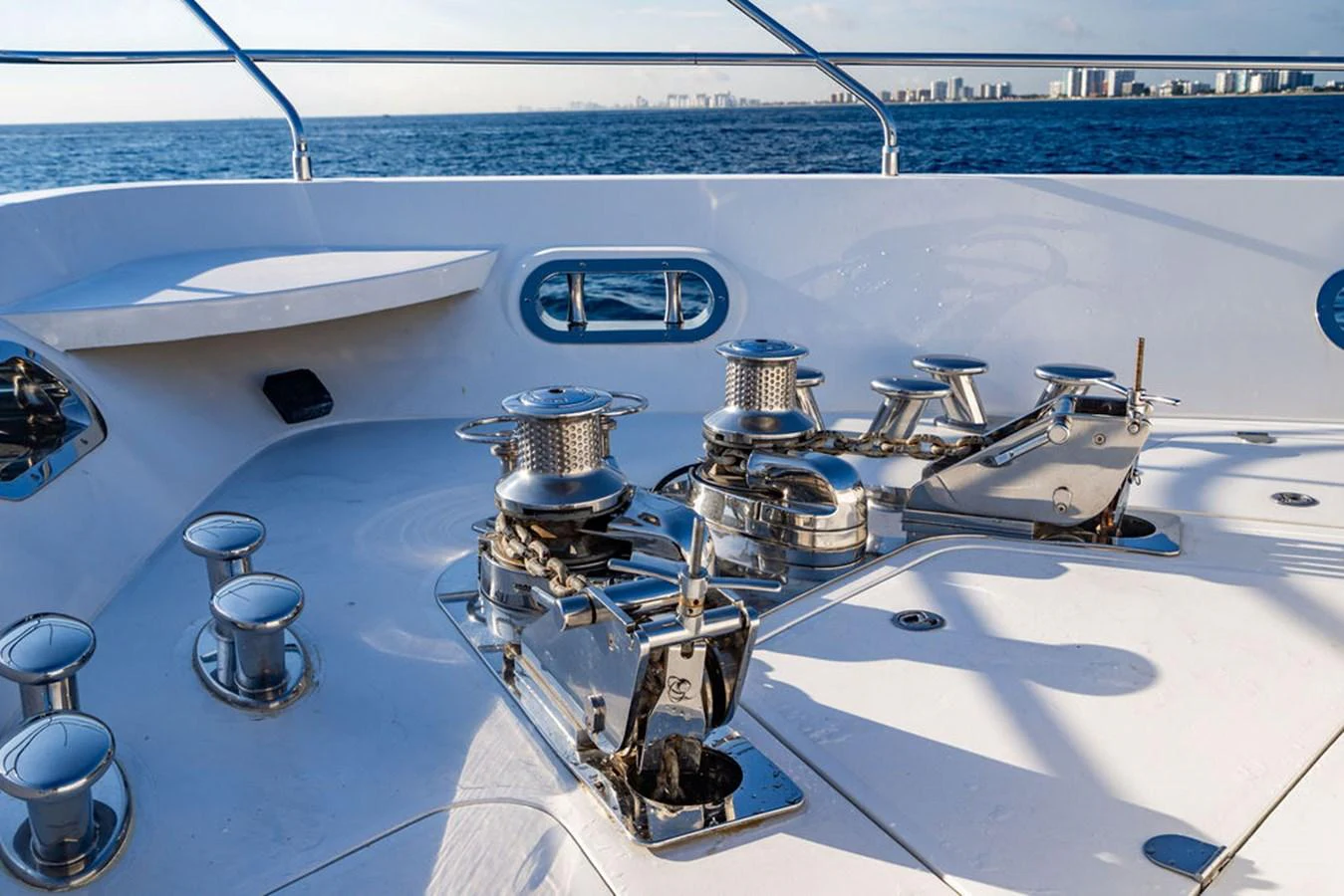 The yacht's deck features polished winches and cleats, showcasing its high-quality craftsmanship. aboard OASIS Yacht for Sale