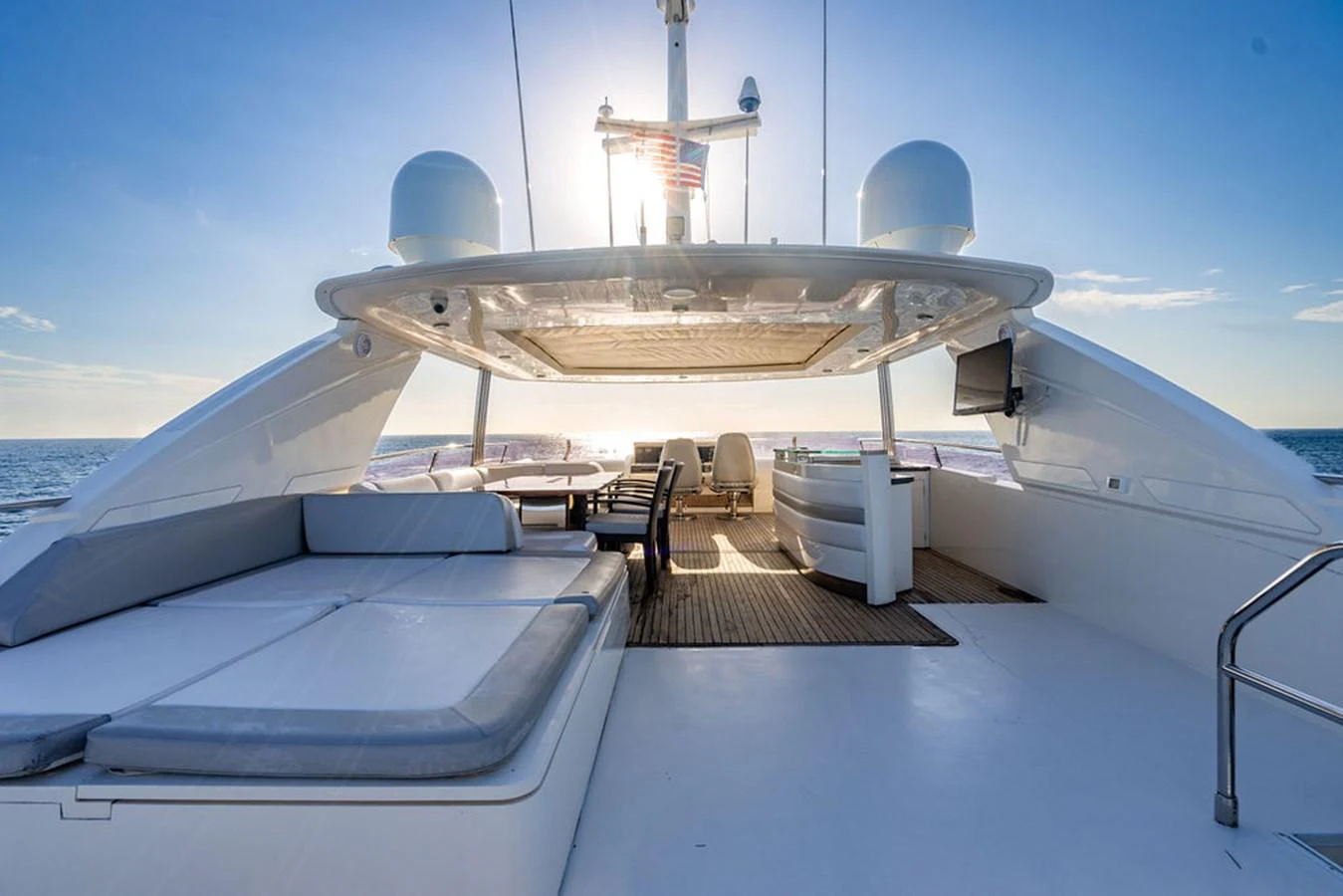 The flybridge offers a spacious and luxurious outdoor area with ample seating and stunning ocean views. aboard OASIS Yacht for Sale