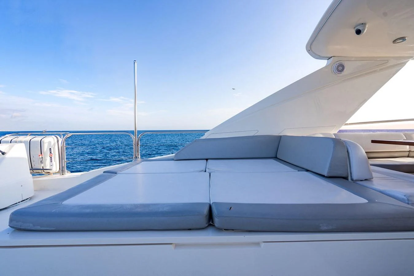 The sundeck offers a spacious and comfortable lounging area with a stunning ocean view. aboard OASIS Yacht for Sale