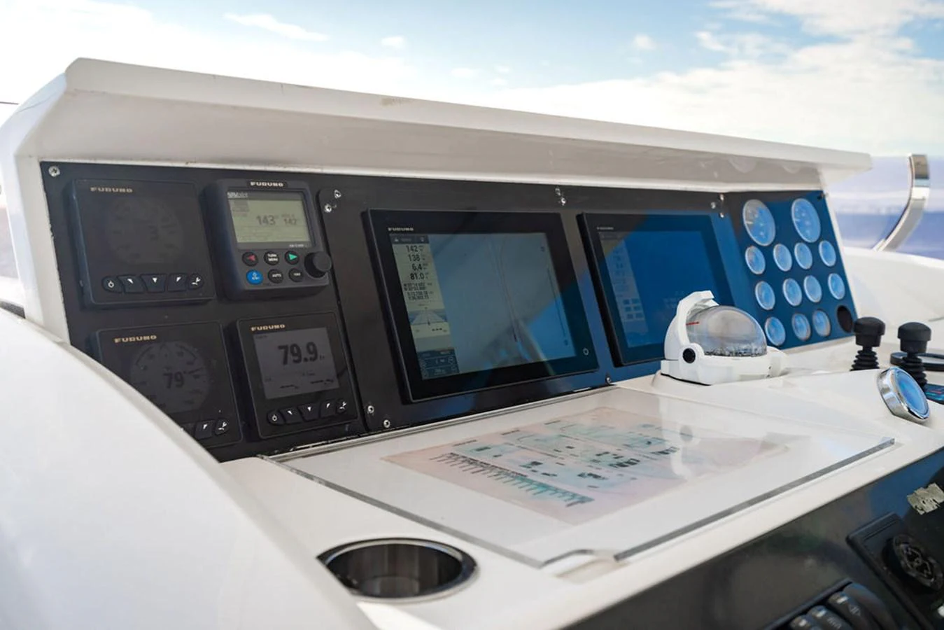 The helm station features advanced navigation and control systems for a seamless sailing experience. aboard OASIS Yacht for Sale