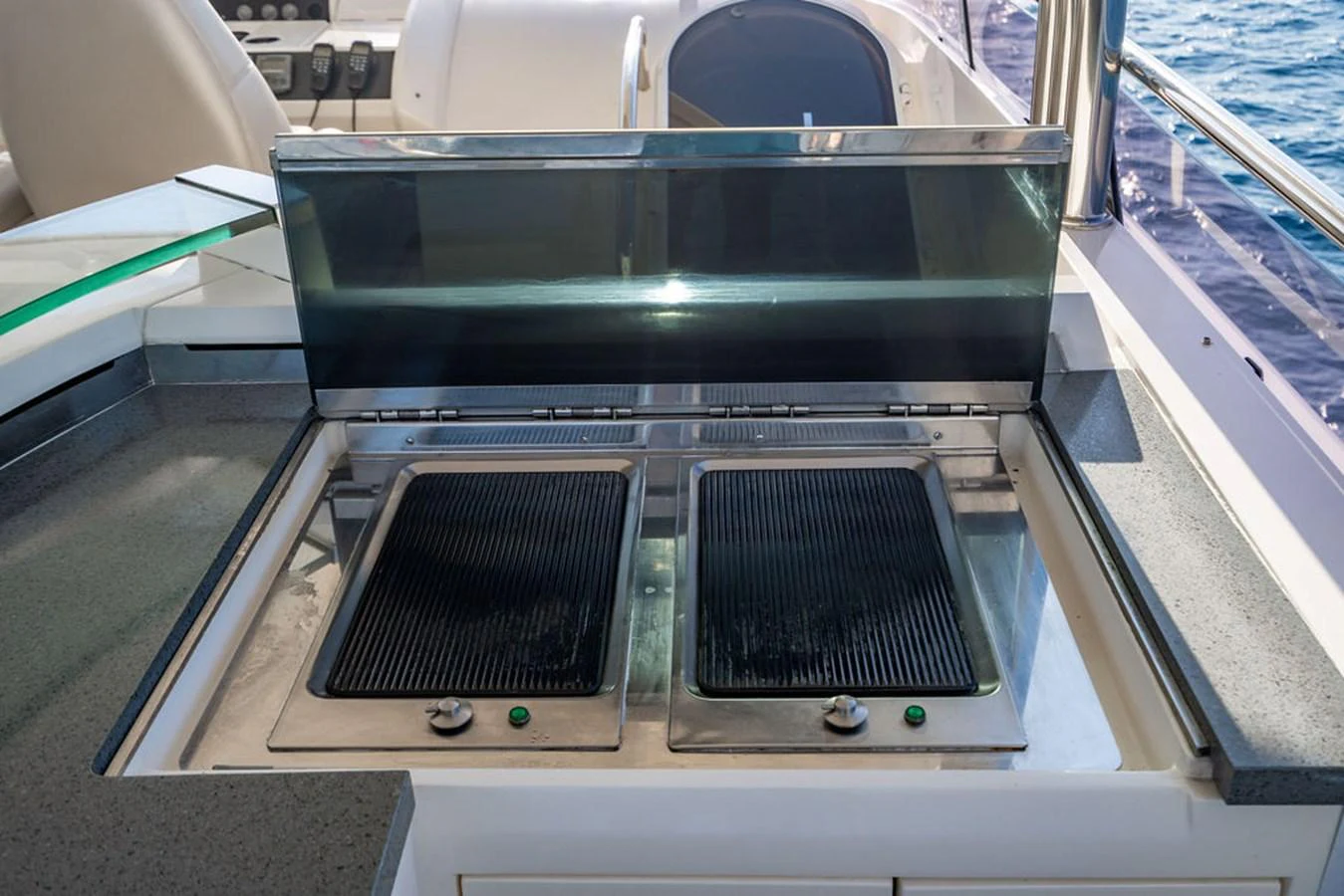 The yacht features a sleek outdoor grill perfect for alfresco dining. aboard OASIS Yacht for Sale