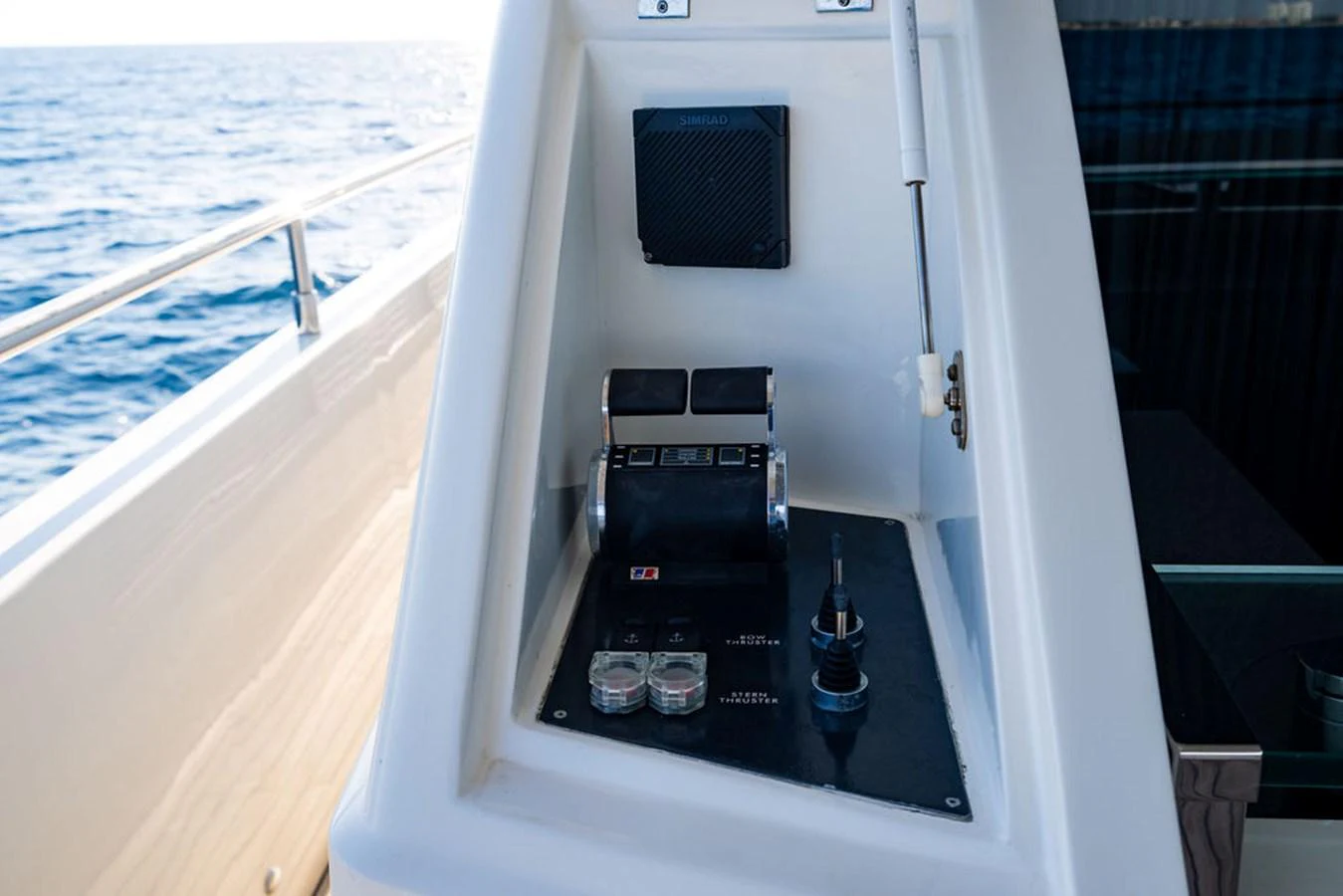 A close-up view of the yacht's helm controls, showcasing the precision and quality of the navigation instruments. aboard OASIS Yacht for Sale