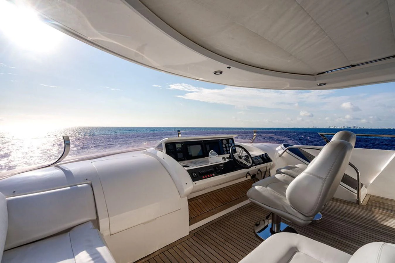 The helm station offers a commanding view of the open sea, with luxurious seating and state-of-the-art navigation equipment. aboard OASIS Yacht for Sale