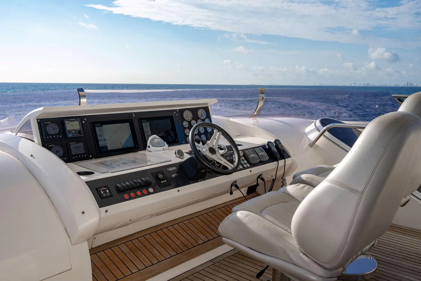 The helm station offers a commanding view of the open sea with state-of-the-art navigation equipment. aboard OASIS Yacht for Sale
