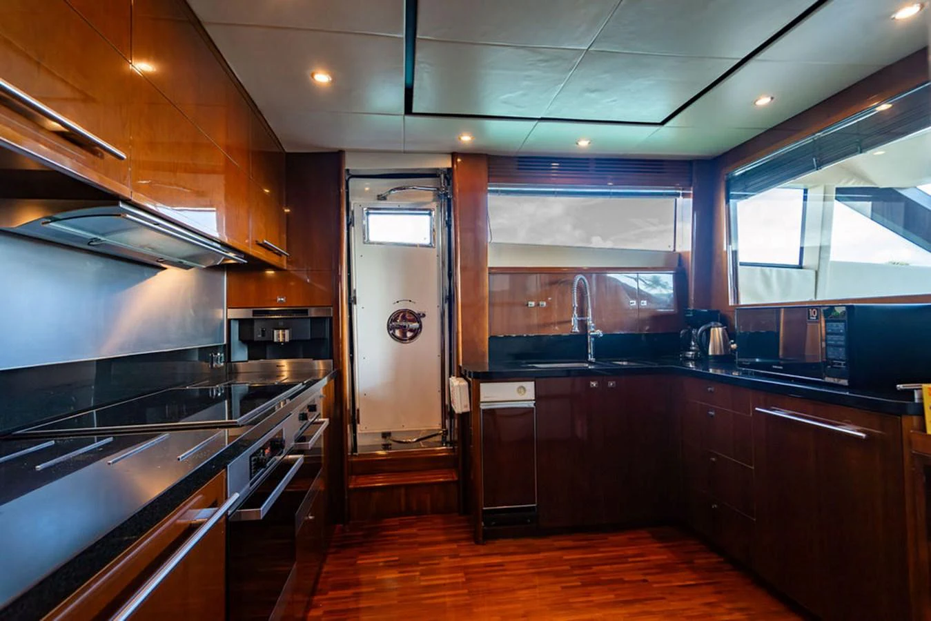 The galley features modern appliances and sleek cabinetry, offering a functional and stylish cooking space. aboard OASIS Yacht for Sale