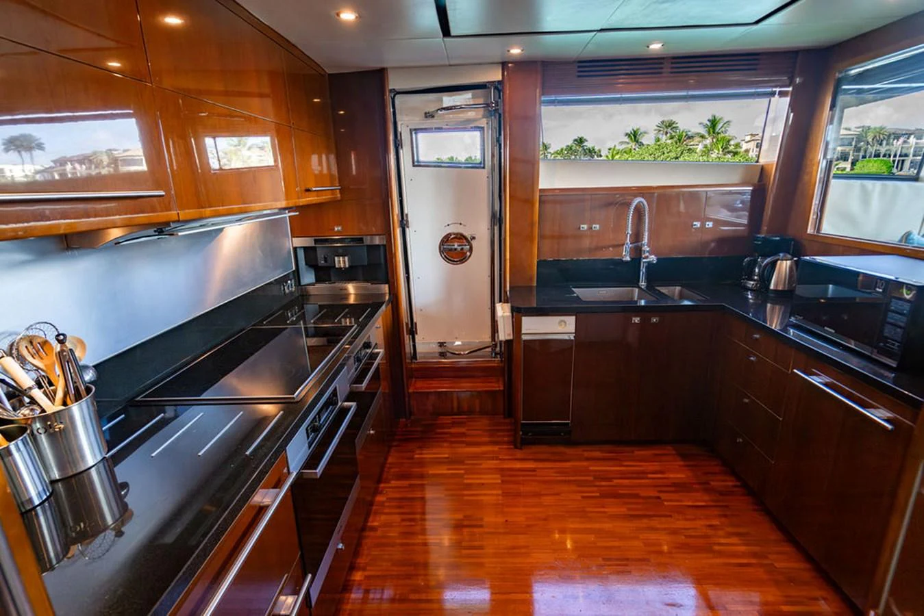 The yacht's galley is equipped with modern appliances and sleek cabinetry, offering a functional and stylish space for meal preparation. aboard OASIS Yacht for Sale
