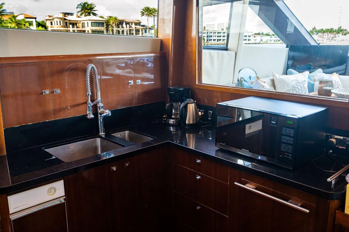 A well-equipped galley with modern appliances and a sleek design. aboard OASIS Yacht for Sale