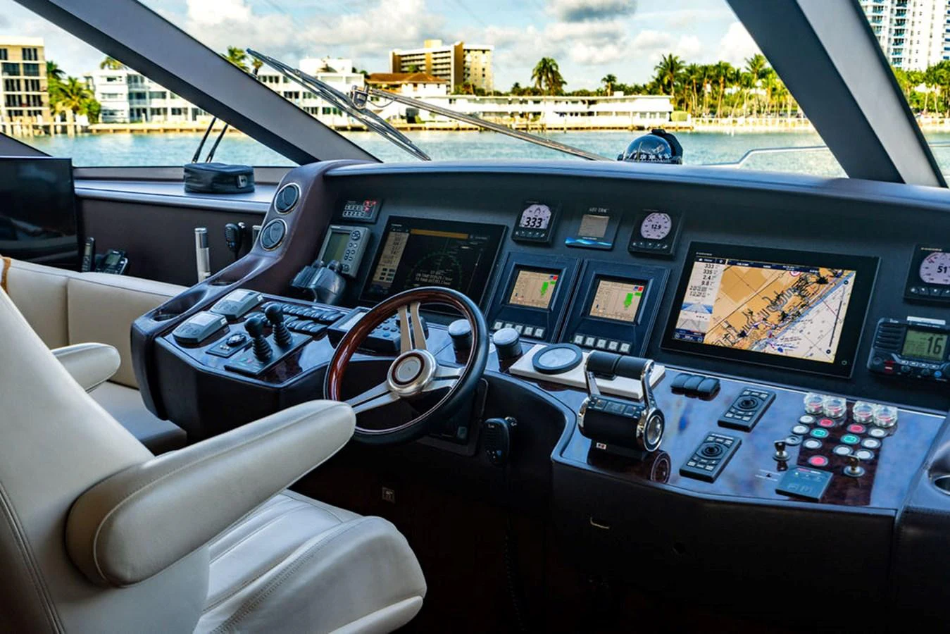 The helm station offers a sophisticated array of navigation and control systems with a panoramic view of the surroundings. aboard OASIS Yacht for Sale