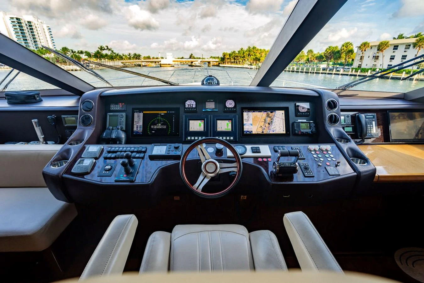 The helm offers a sophisticated and well-equipped command center with panoramic views. aboard OASIS Yacht for Sale