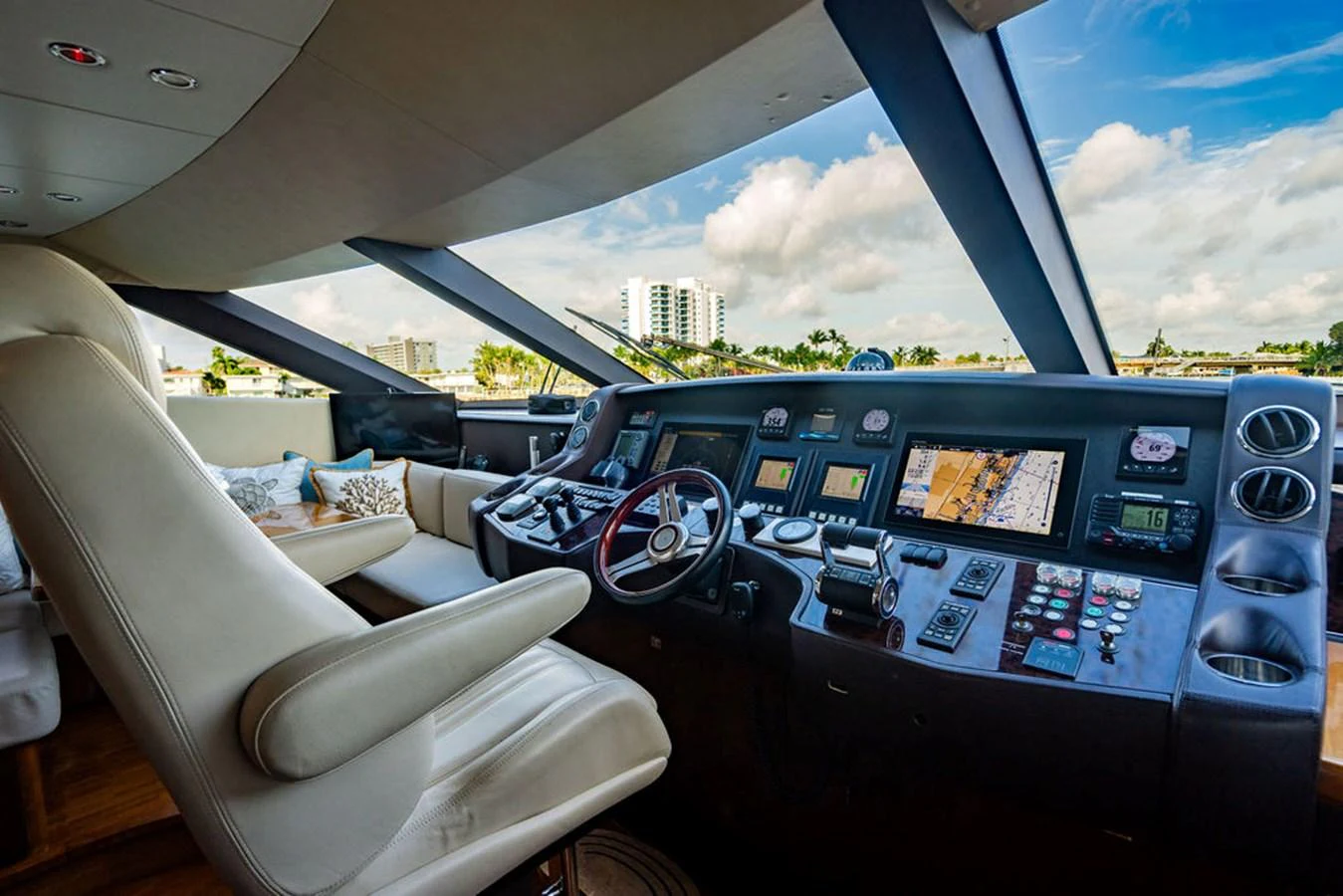 The helm station offers a sophisticated and commanding view with state-of-the-art navigation equipment. aboard OASIS Yacht for Sale