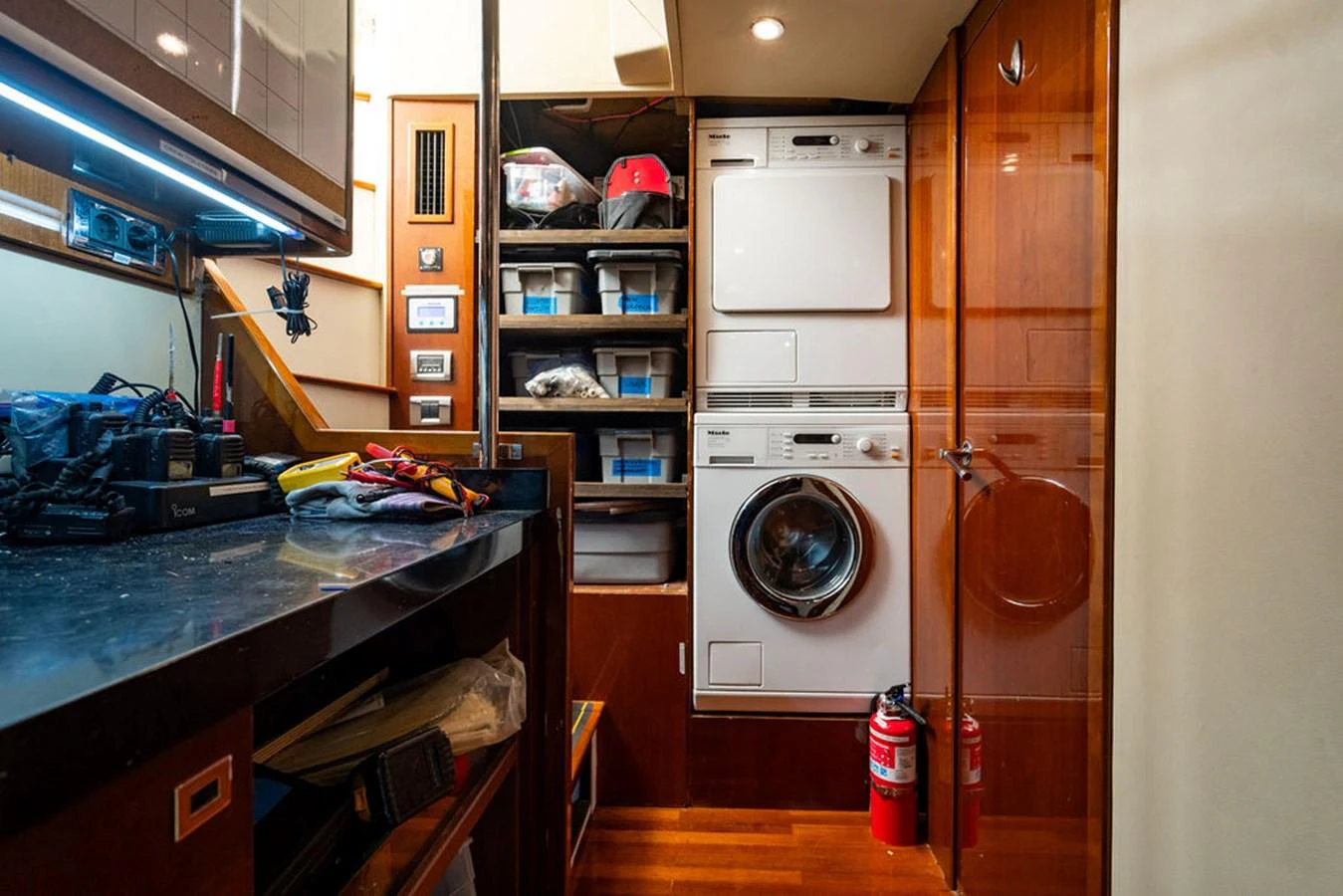 The yacht's laundry room is equipped with modern appliances and ample storage space. aboard OASIS Yacht for Sale