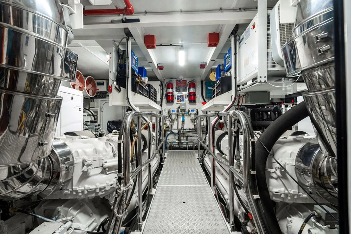 The image showcases the well-organized and high-tech engine room of the yacht. aboard OASIS Yacht for Sale