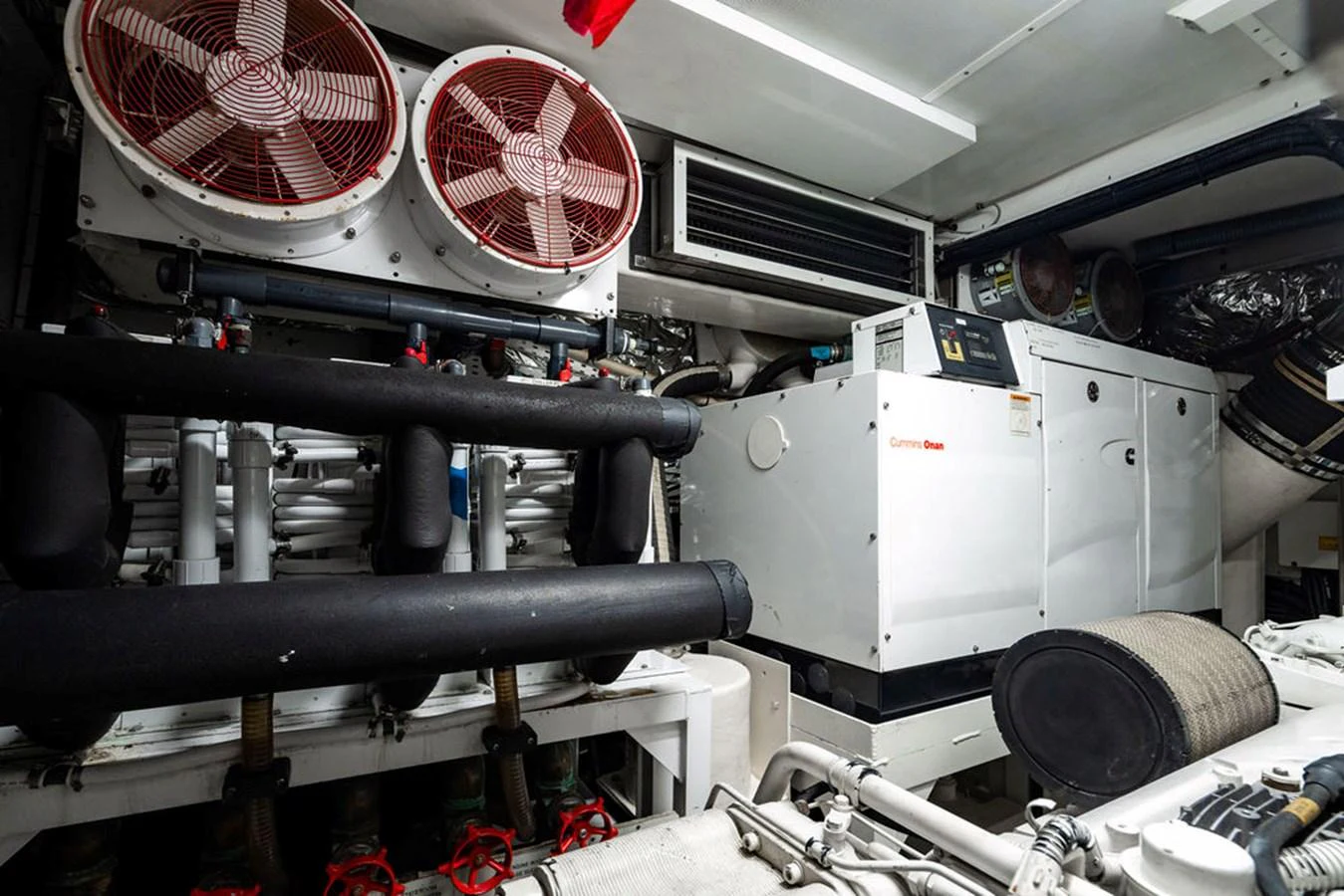 The image showcases the well-maintained engine room of the yacht, highlighting its technical equipment. aboard OASIS Yacht for Sale