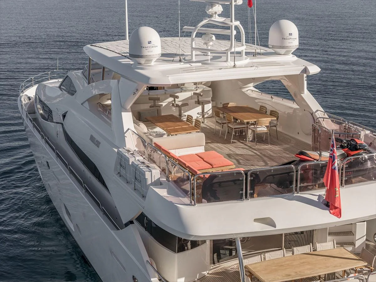 The yacht's aft deck features a spacious and inviting outdoor dining and lounging area. aboard FINAL CUT Yacht for Sale