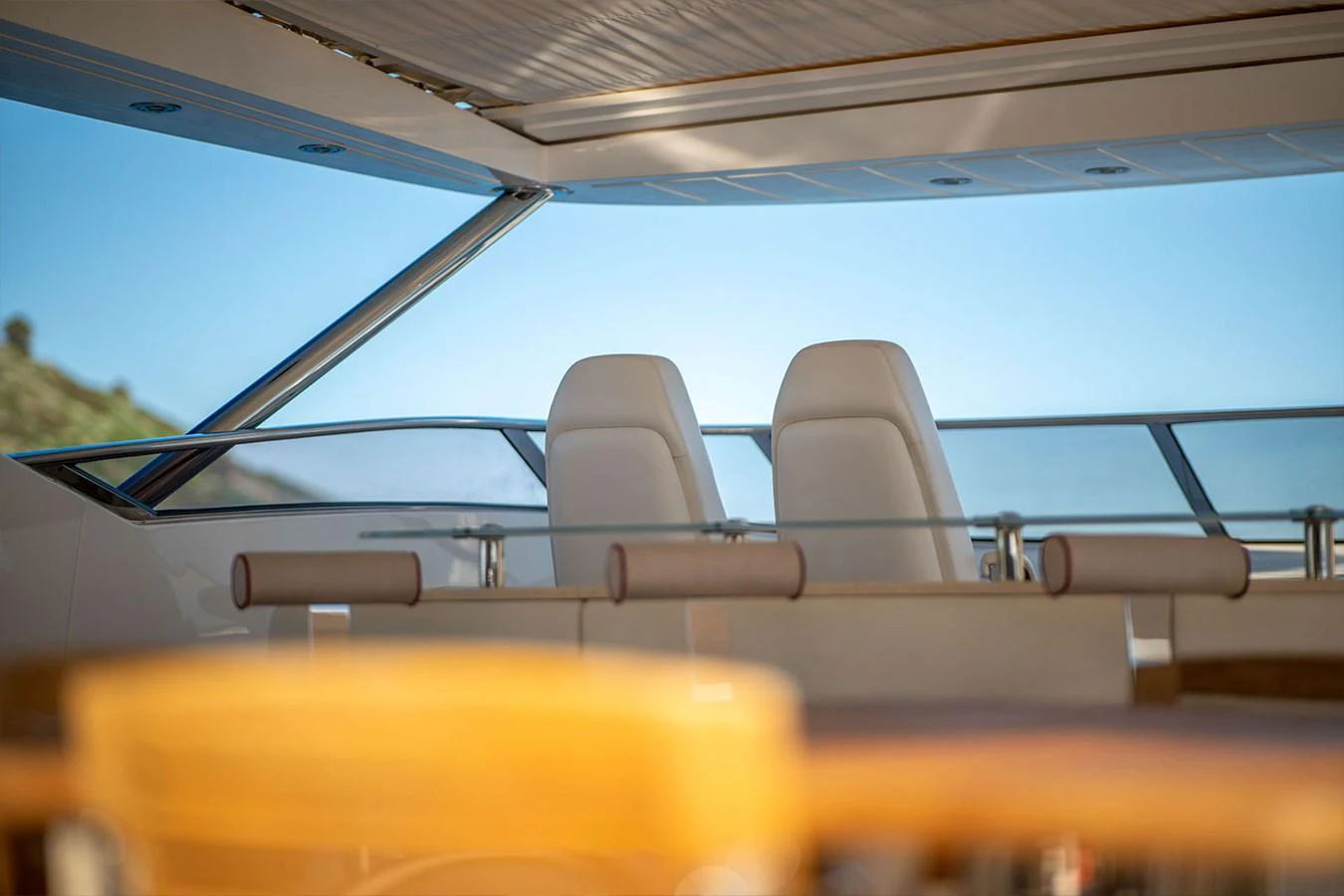The yacht's helm area features sleek, modern seating with a panoramic view. aboard FINAL CUT Yacht for Sale