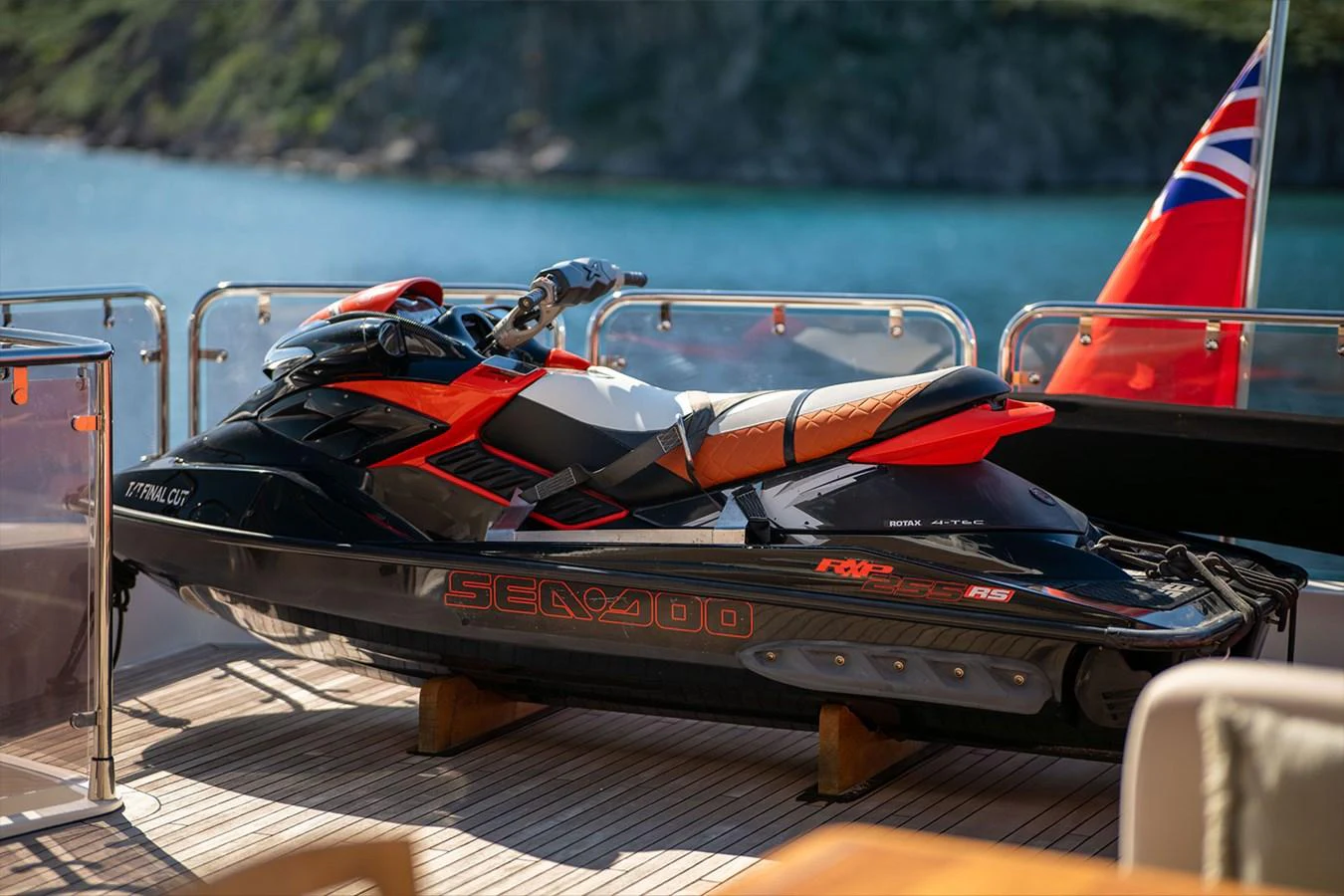 A sleek jet ski is securely placed on the deck of a yacht, ready for thrilling water adventures. aboard FINAL CUT Yacht for Sale