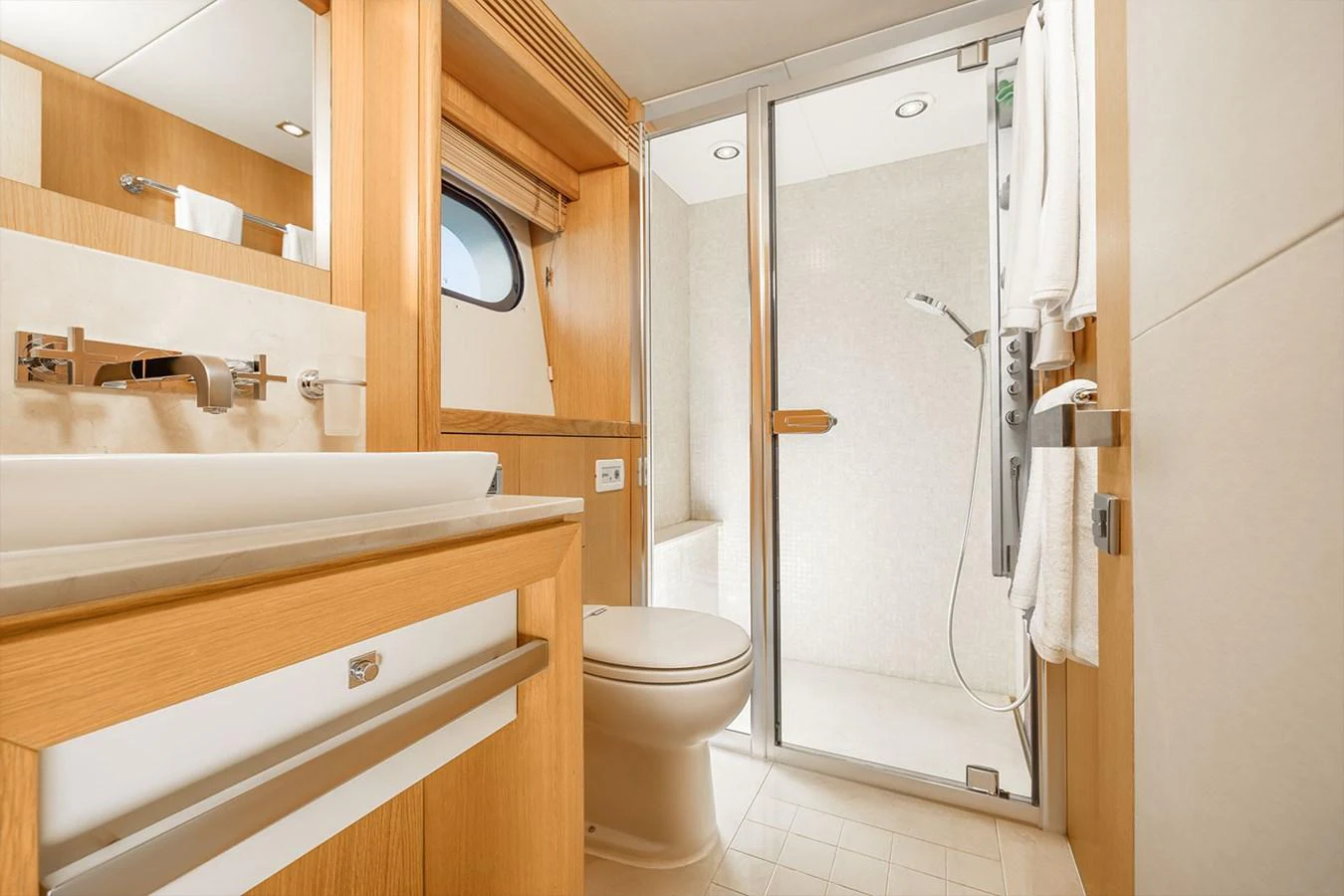 The yacht's bathroom features modern fixtures and a spacious shower area. aboard FINAL CUT Yacht for Sale
