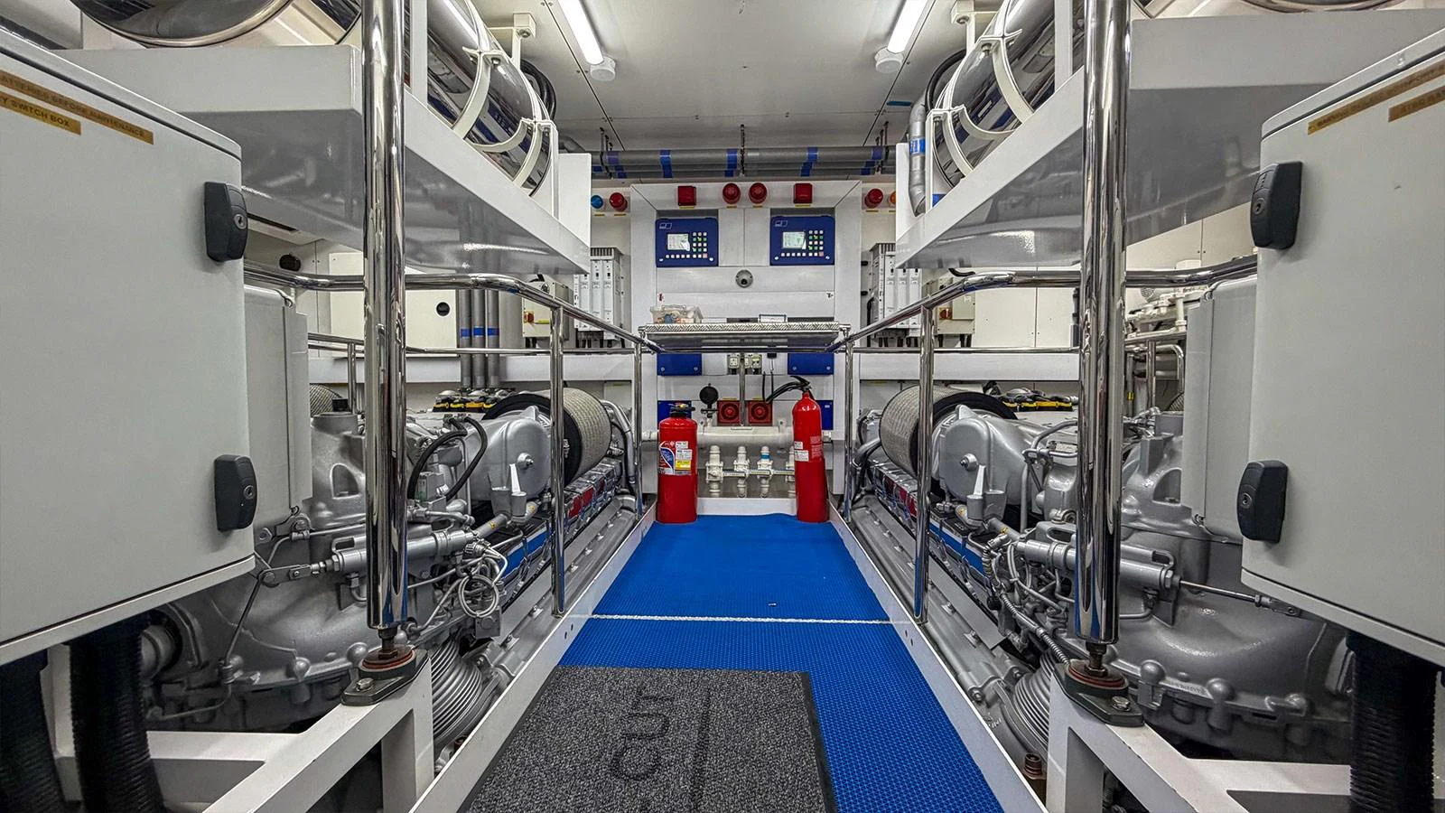 The engine room is meticulously organized, showcasing advanced machinery and safety equipment. aboard FINAL CUT Yacht for Sale