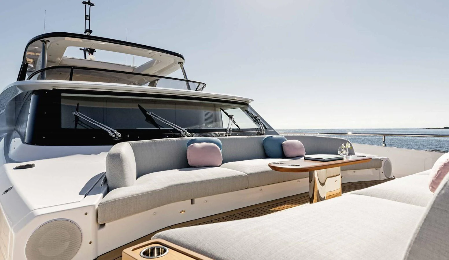 The foredeck features a luxurious seating area with plush cushions and a sleek table, perfect for relaxation. aboard MARYBELLE Yacht for Sale