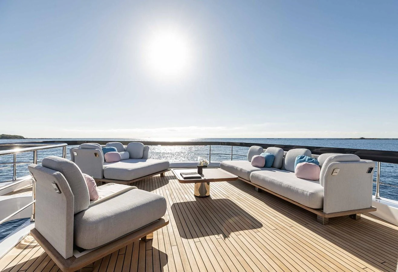 The sundeck offers a luxurious lounging area with plush seating and stunning ocean views. aboard MARYBELLE Yacht for Sale