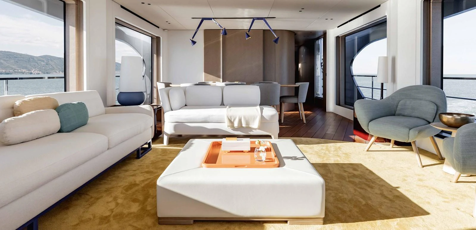 The yacht's salon features modern furnishings with ample natural light and panoramic views. aboard MARYBELLE Yacht for Sale