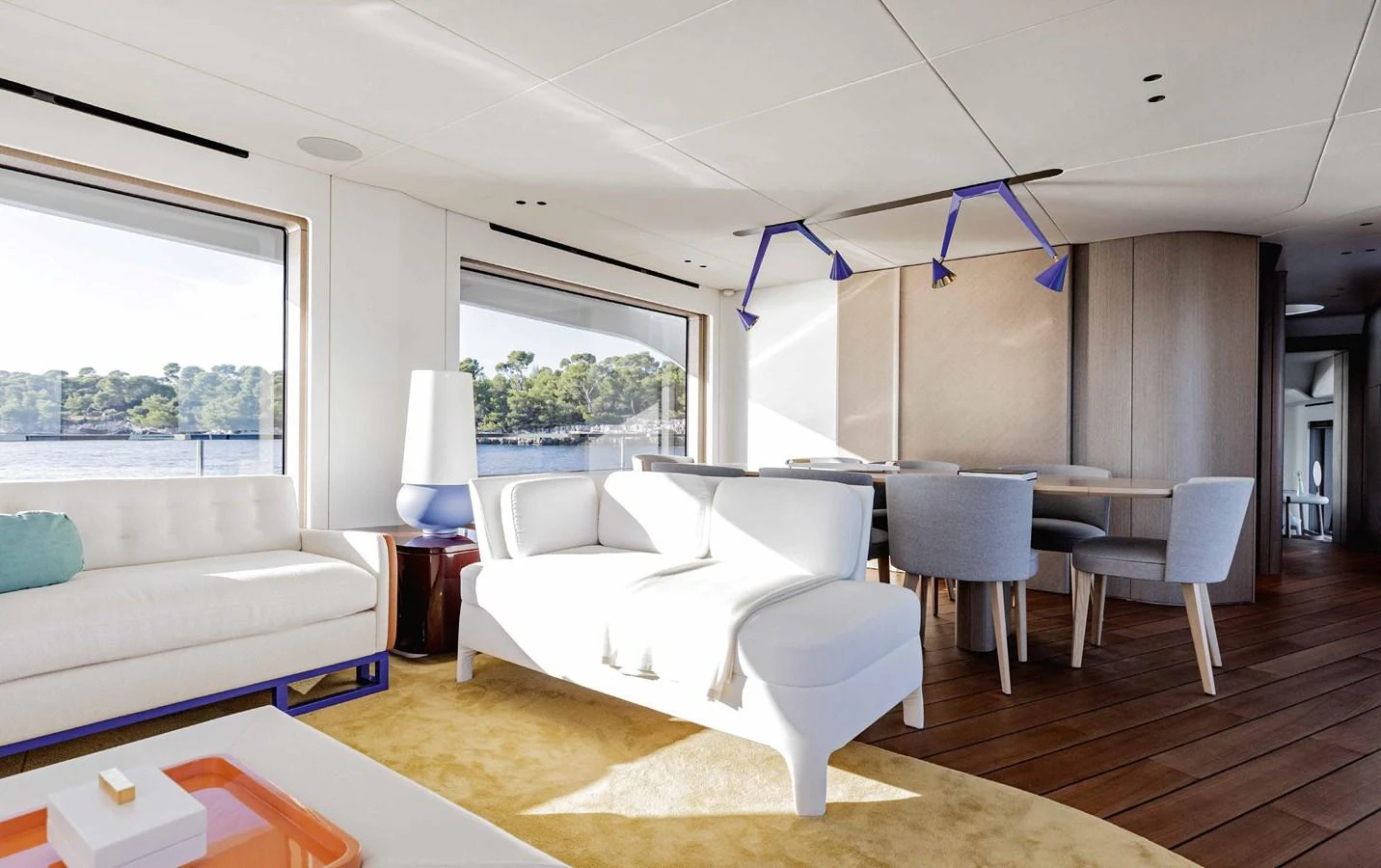 The salon features modern furnishings with large windows offering stunning views. aboard MARYBELLE Yacht for Sale