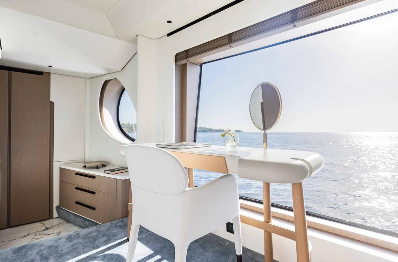 A serene stateroom with a desk and large windows offering stunning sea views. aboard MARYBELLE Yacht for Sale