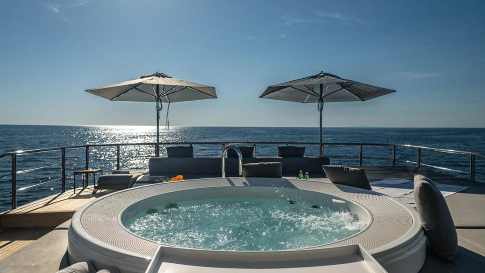 The sundeck features a luxurious jacuzzi with stunning ocean views, perfect for relaxation. aboard R23 Yacht for Sale