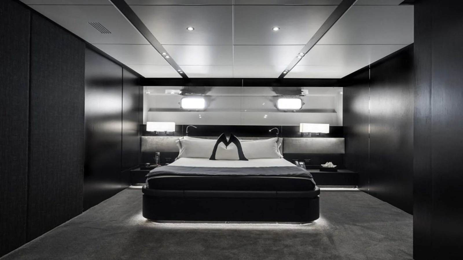The master stateroom exudes modern elegance with its sleek design and ambient lighting. aboard R23 Yacht for Sale