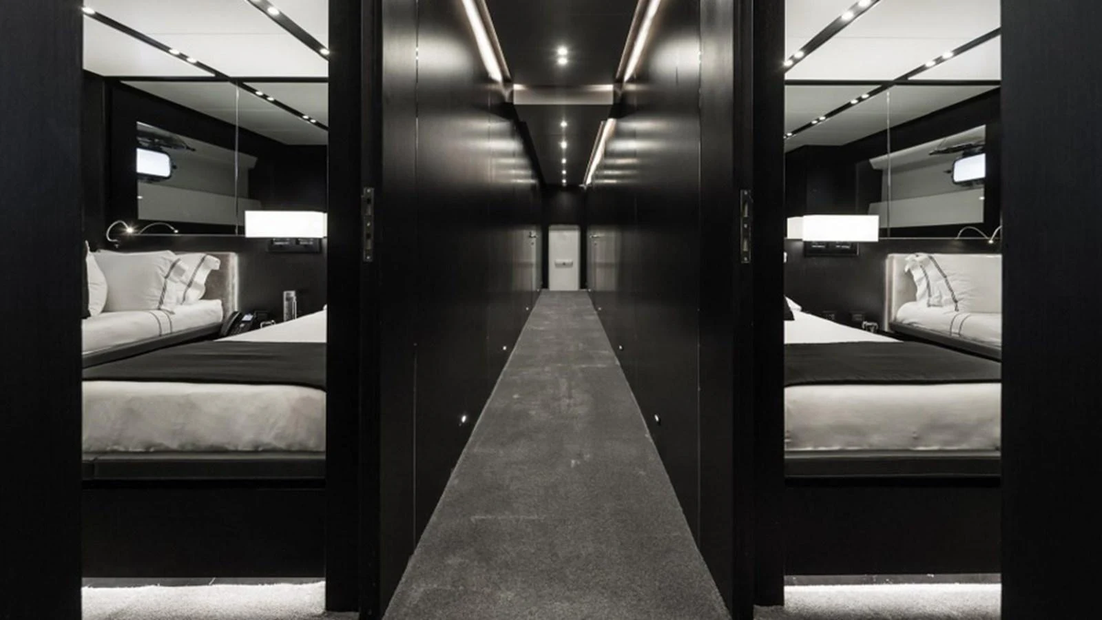 A sleek and modern hallway with luxurious staterooms on either side. aboard R23 Yacht for Sale